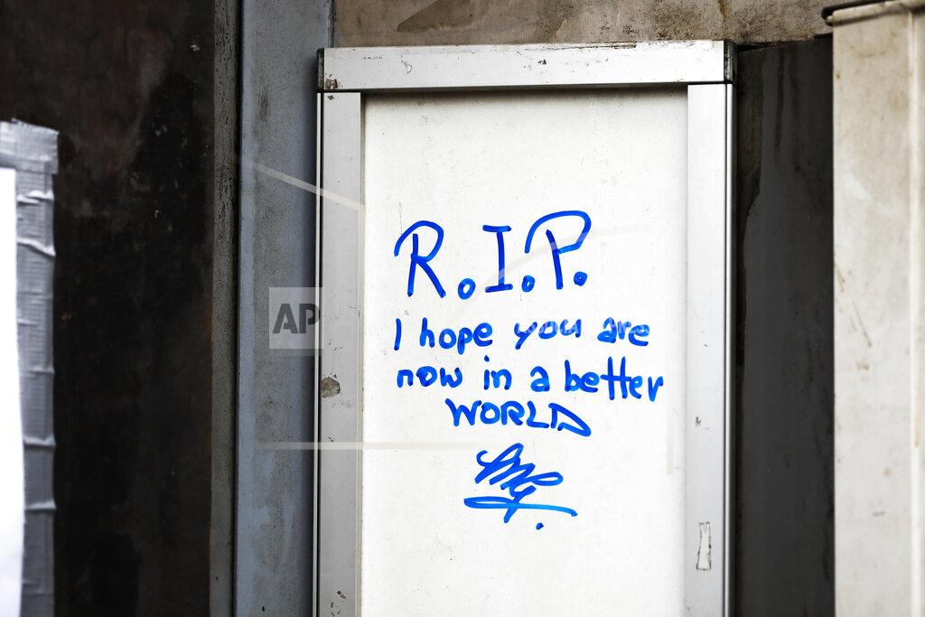 Lisa Leutner A message is seen at the entrance of the tobacco shop belonging to a woman who was covered on gasoline and lit on fire by her former partner Vienna, Austria, Friday, May 14, 2021. Austria is one of the few European Union countries where the number of women killed is higher than the number of men. The recent high-profile cases have led to widespread protests, demands for government intervention and condemnations from top politicians. (AP Photo/Lisa Leutner)