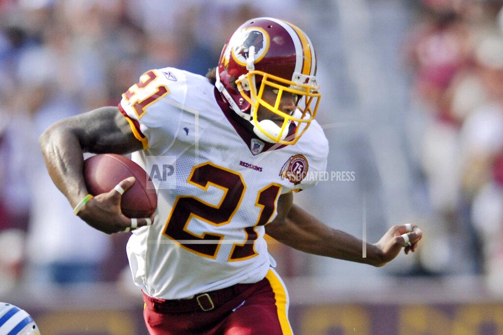 Nick Wass FILE - In this Oct. 7, 2007, file photo, Washington Redskins safety Sean Taylor carries the ball during an NFL football game against the Detroit Lions in Landover, Md. The Washington Football Team plans to retire late safety Sean Taylor's number before its upcoming game against Kansas City. (AP Photo/Nick Wass, File)