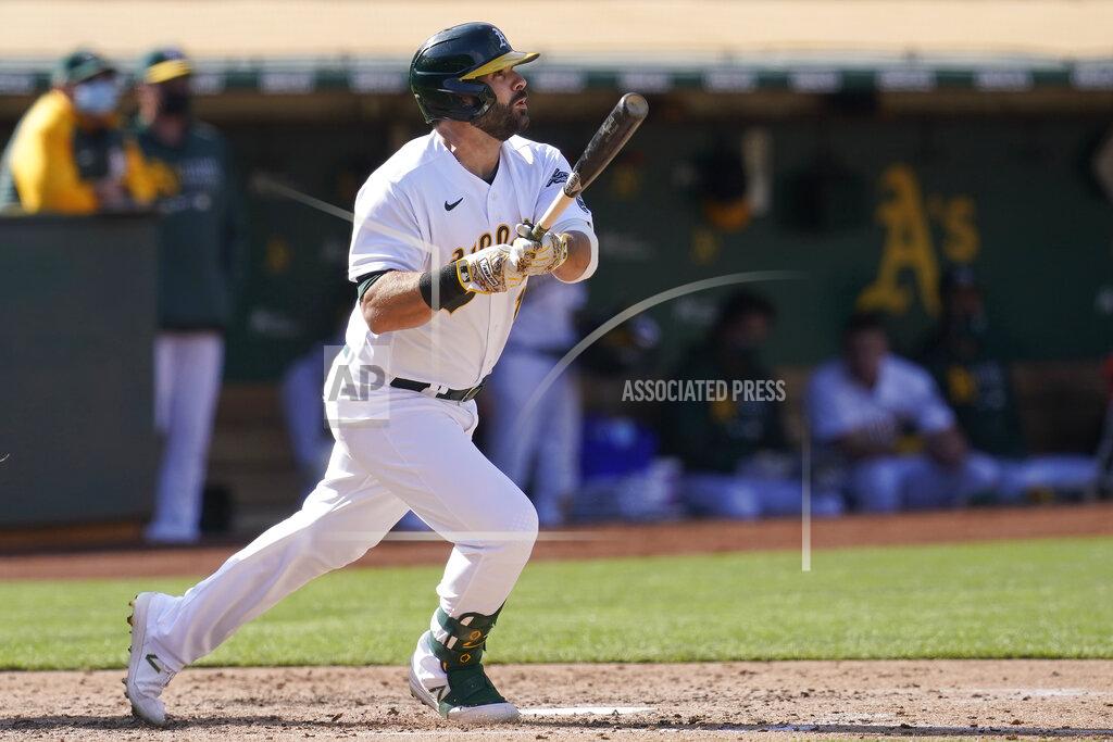 Jeff Chiu Oakland Athletics' Mitch Moreland watches his solo home run against the Minnesota Twins during the fourth inning of the first baseball game of a doubleheader in Oakland, Calif., Tuesday, April 20, 2021. (AP Photo/Jeff Chiu)