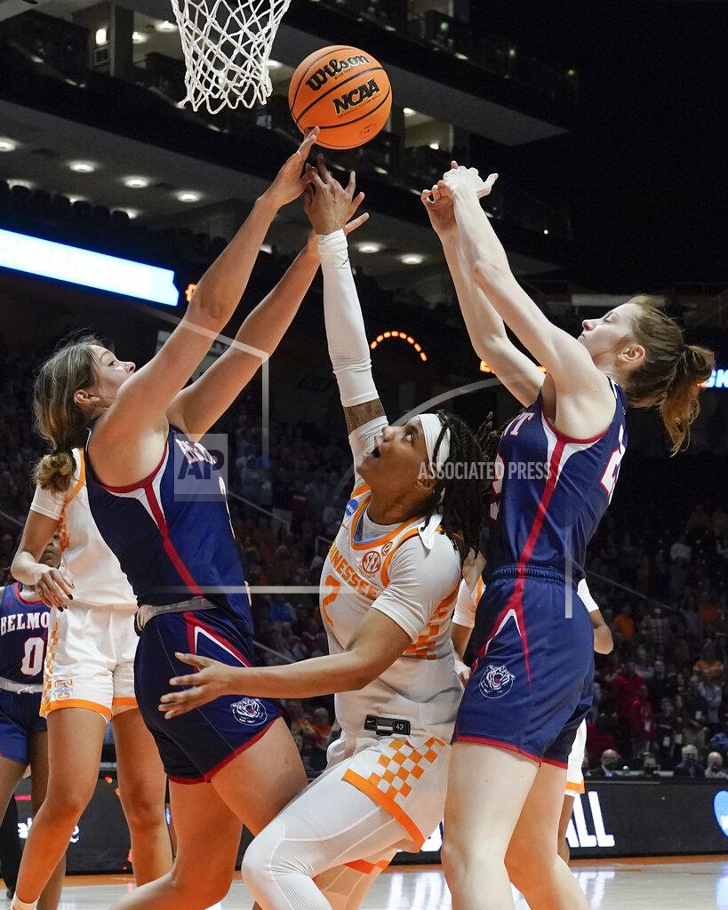 Mark Humphrey Tennessee's Alexus Dye (2) tries to shoot from between Belmont's Madison Bartley, left, and Belmont's Nikki Baird, right, in the second half of a women's college basketball game in the second round of the NCAA tournament Monday, March 21, 2022, in Knoxville, Tenn. Tennessee won 70-67. (AP Photo/Mark Humphrey)