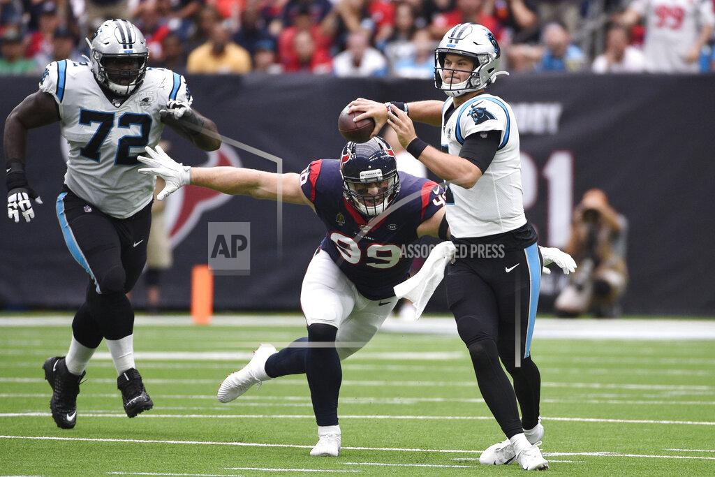 Eric Christian Smith Carolina Panthers quarterback Kyle Allen (7) is pressured by Houston Texans defensive end J.J. Watt (99) during the first half of an NFL football game Sunday, Sept. 29, 2019, in Houston. (AP Photo/Eric Christian Smith)