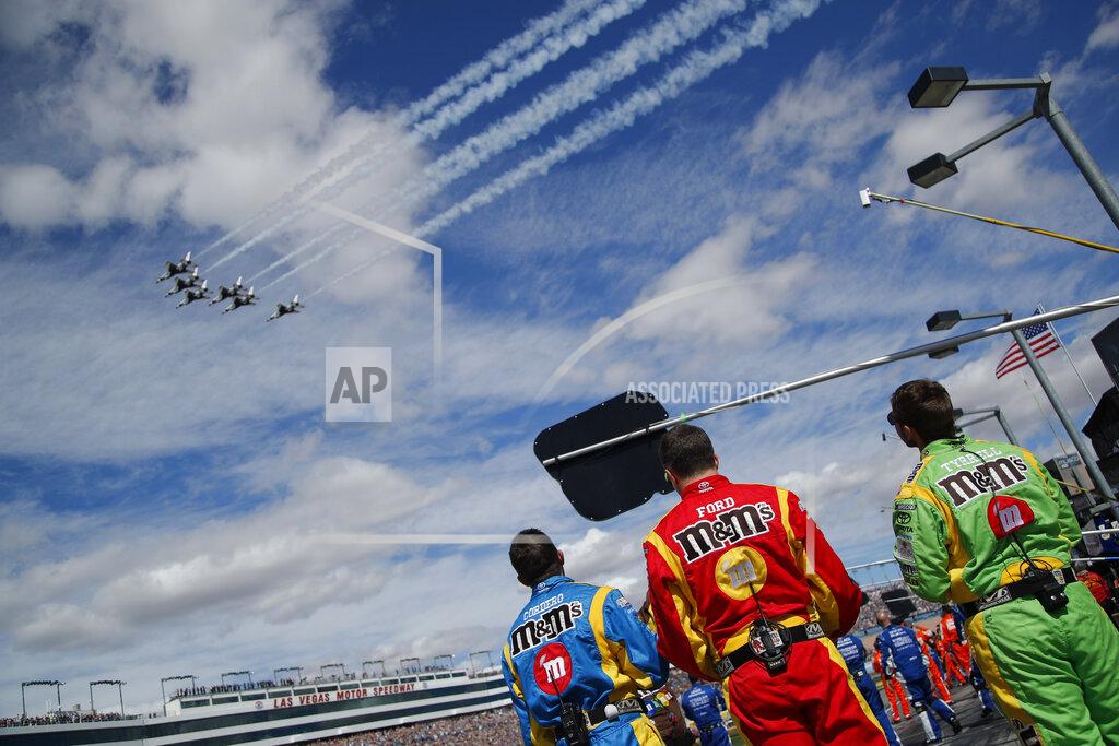 John Locher Kyle Busch's crew members watch the Thunderbirds fly over before a NASCAR Cup Series auto race at Las Vegas Motor Speedway, Sunday, March 3, 2019, in Las Vegas. (AP Photo/John Locher)