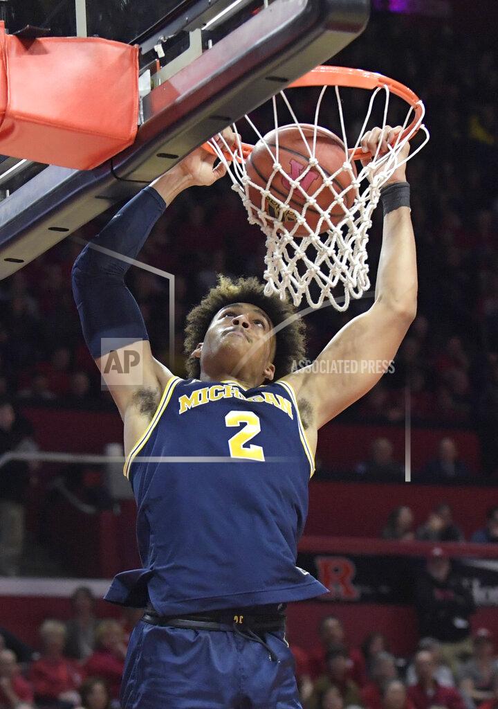 Bill Kostroun Michigan guard Jordan Poole dunks the ball during the first half of an NCAA college basketball game against Rutgers Tuesday, Feb. 5, 2019, in Piscataway, N.J. (AP Photo/Bill Kostroun)