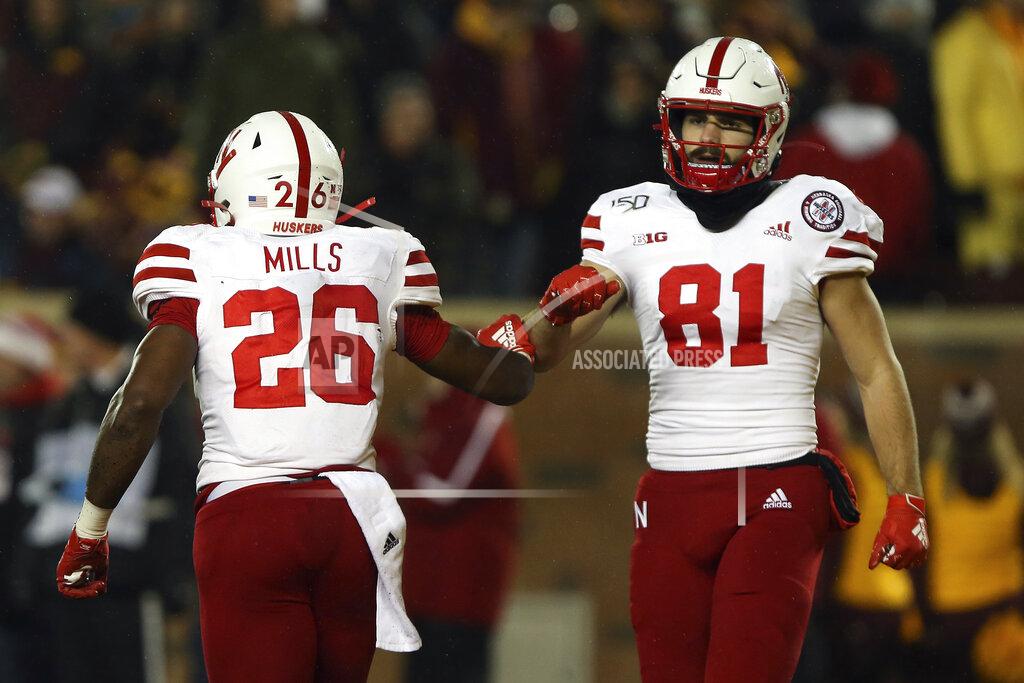 Stacy Bengs Nebraska running back Dedrick Mills celebrates with wide receiver Kade Warner after scoring a touchdown during the second half of an NCAA college football game against Minnesota, Saturday, Oct. 12, 2019, in Minneapolis. (AP Photo/Stacy Bengs)