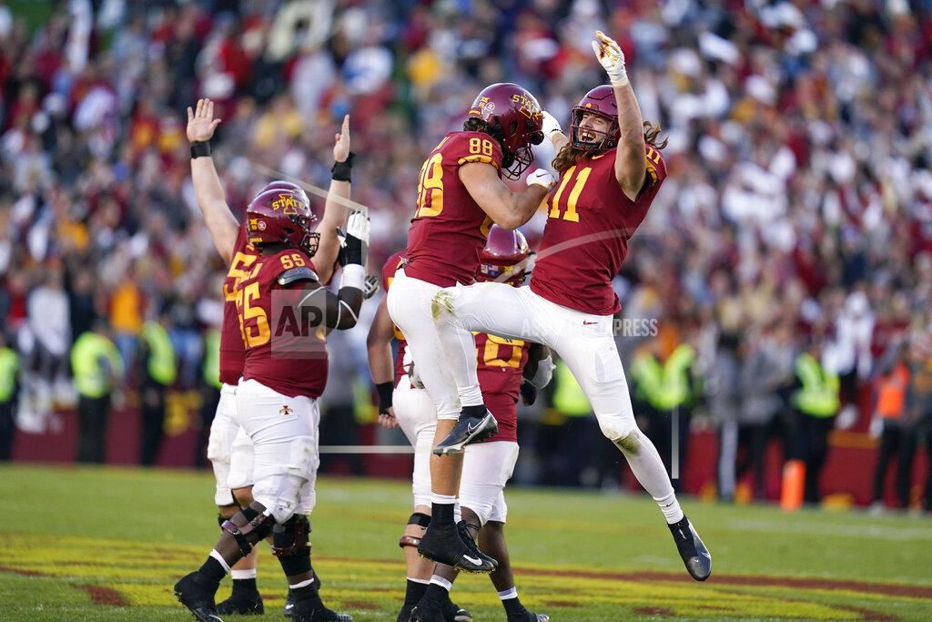 Charlie Neibergall Iowa State's Chase Allen (11) celebrates with teammate Charlie Kolar (88) during the second half of an NCAA college football game against Oklahoma State, Saturday, Oct. 23, 2021, in Ames, Iowa. Iowa State won 24-21. (AP Photo/Charlie Neibergall)