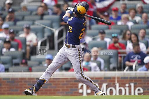 Milwaukee Brewers left fielder Christian Yelich (22) strikes out during the first inning of Game 4 of a baseball National League Division Series against the Atlanta Braves, Tuesday, Oct. 12, 2021, in Atlanta. (AP Photo/Brynn Anderson)