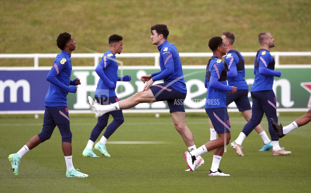Nick Potts England's Harry Maguire, center, during a training session at St George's Park, Burton upon Trent, England, Monday June 14, 2021. (Nick Potts/PA via AP)