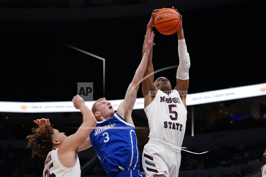 Jeff Roberson Missouri State's Donovan Clay (5) and Drake's Garrett Sturtz (3) reach for a rebound as Missouri State's Lu'Cye Patterson (25) watches during the first half of an NCAA college basketball game in the semifinal round of the Missouri Valley Conference tournament Saturday, March 5, 2022, in St. Louis. (AP Photo/Jeff Roberson)
