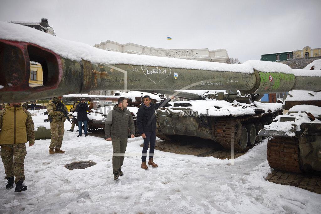 Uncredited FILE - In this photo provided by the Ukrainian Presidential Press Office, Ukrainian President Volodymyr Zelenskyy, left, and British Prime Minister Rishi Sunak observe destroyed Russian military vehicles installed in downtown Kyiv, Ukraine, Nov. 19, 2022. In his first month as Britain's prime minister, Sunak has stabilized the economy, reassured allies from Washington to Kyiv and even soothed the European Union after years of sparring between Britain and the bloc. But Sunak’s challenges are just beginning. He is facing a stagnating economy, a cost-of-living crisis – and a Conservative Party that is fractious and increasingly unpopular after 12 years in power. (Ukrainian Presidential Press Office via AP, File)