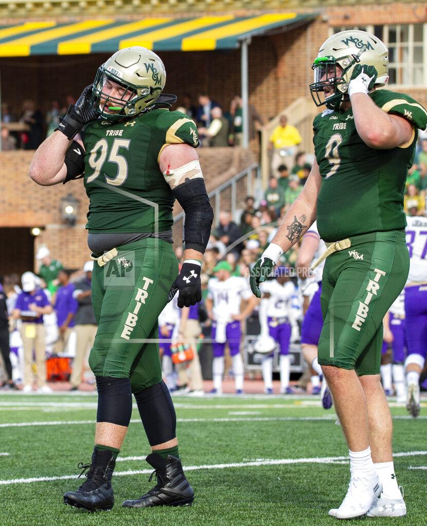 Mike Caudill William & Mary's Bill Murray (95) and Carl Fowler (9) walk off the field in frustration after giving up a touchdown to James Madison during an NCAA college football game in Williamsburg, Va., on Saturday, Oct. 19, 2019. (Mike Caudill/The Virginian-Pilot via AP)