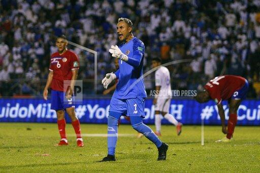 Costa Rica's goalkeeper Keylor Navas instructs teammates during a qualifying soccer match against Honduras for the FIFA World Cup Qatar 2022 at the Metropolitan Olympic stadium in San Pedro Sula, Honduras, Thursday, Oct., 7, 2021. (AP Photo/Delmer Martinez)