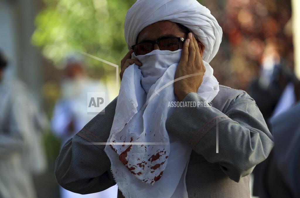 Rahmat Gul A Religious student cry inside a mosque after a bomb explosion in Shakar Dara district of Kabul, Afghanistan, Friday, May 14, 2021. A bomb ripped through a mosque in northern Kabul during Friday prayers killing 12 worshippers, Afghan police said. (AP Photo/Rahmat Gul)