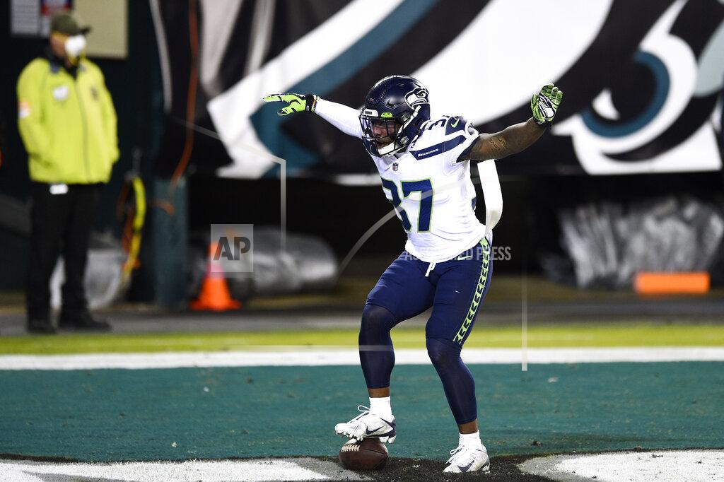 Derik Hamilton Seattle Seahawks' Quandre Diggs (37) reacts after intercepting a pass by Philadelphia Eagles' Carson Wentz during the second half of an NFL football game, Monday, Nov. 30, 2020, in Philadelphia. (AP Photo/Derik Hamilton)