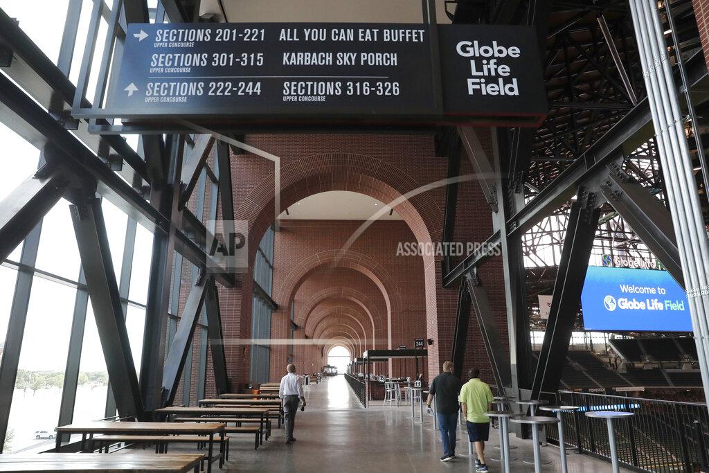 Lm Otero In this photo made Thursday, July 23, 2020, an view of the walkway is shown at the new Texas Rangers home baseball stadium named Globe Life Field in Arlington, Texas. The Texas Rangers' new stadium isn't retro and designers wanted the first next-generation ballpark. There is the full-panel retractable roof, the split seating levels offering full views of the ballpark with plenty of natural light. (AP Photo/LM Otero)