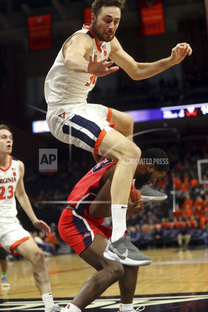 Andrew Shurtleff Virginia forward Jay Huff (30) leaps over Stony Brook guard Andrew Garcia (23) during an NCAA college basketball game in Charlottesville, Va., Wednesday, Dec. 18, 2019. (AP Photo/Andrew Shurtleff)