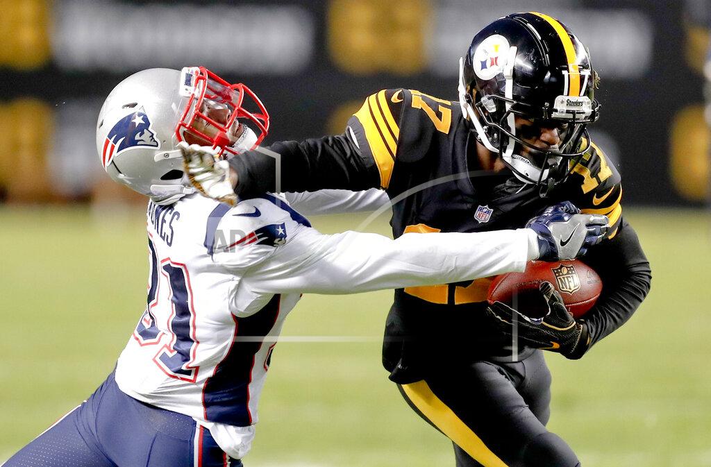 Keith Srakocic FILE - In this Dec. 16, 2018, file photo, Pittsburgh Steelers wide receiver Eli Rogers (17) runs away from New England Patriots defensive back Jonathan Jones (31) during the first half of an NFL football game in Pittsburgh. The Steelers re-signed Rogers to a two-year contract on Thursday, March 14, 2019. (AP Photo/Keith Srakocic, File)