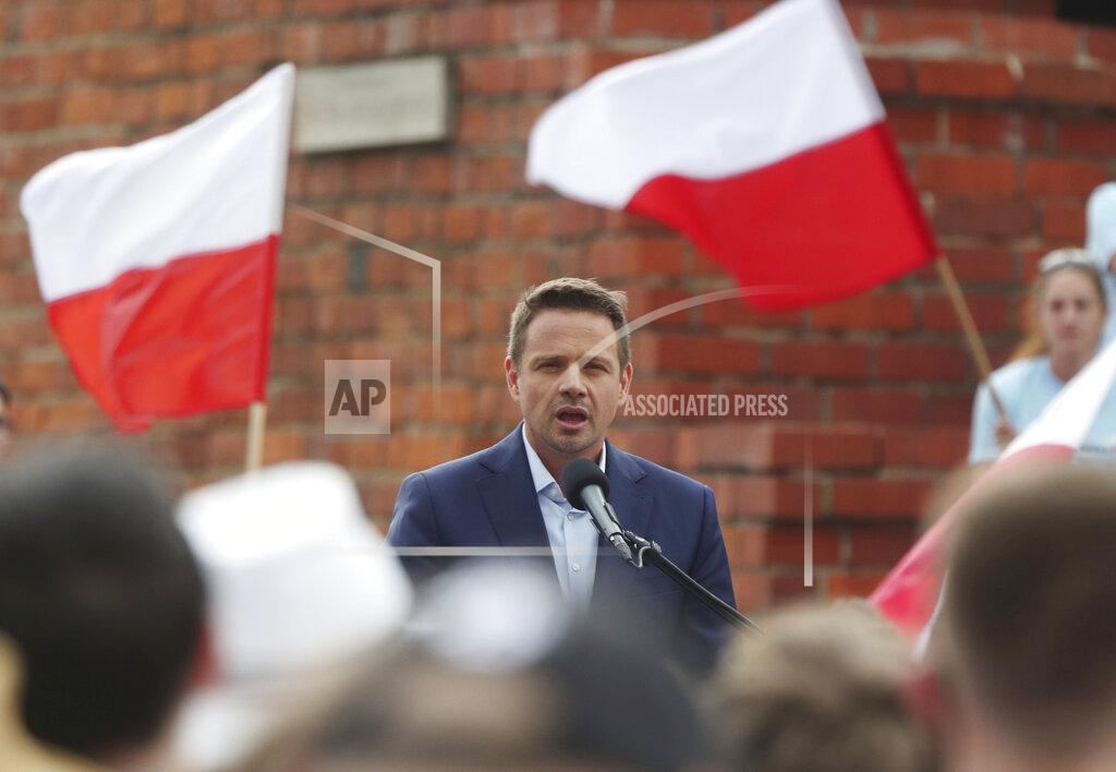 Czarek Sokolowski Candidate in Poland's presidential election, Warsaw centrist Mayor Rafal Trzaskowski addresses supporters on the last day of campaigning before Sunday's vote, in Castle Square in Warsaw, Poland, on Friday, June 26, 2020. Trzaskowski is a major challenger to incumbent conservative President Andrzej Duda who is seeking a second five-year term and is leading in the polls. (AP Photo/Czarek Sokolowski)