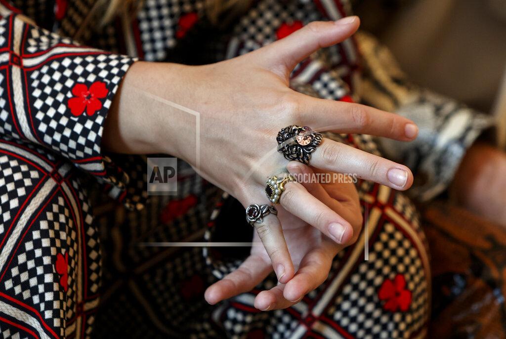 Riccardo De Luca Victoria De Angelis, bass player of of Italian band Maneskin, winners of the Eurovision Song Contest in May, touches the rings on her hand during an interview with the Associated Press at a hotel in Rome, Tuesday, July 27, 2021. (AP Photo/Riccardo De Luca)