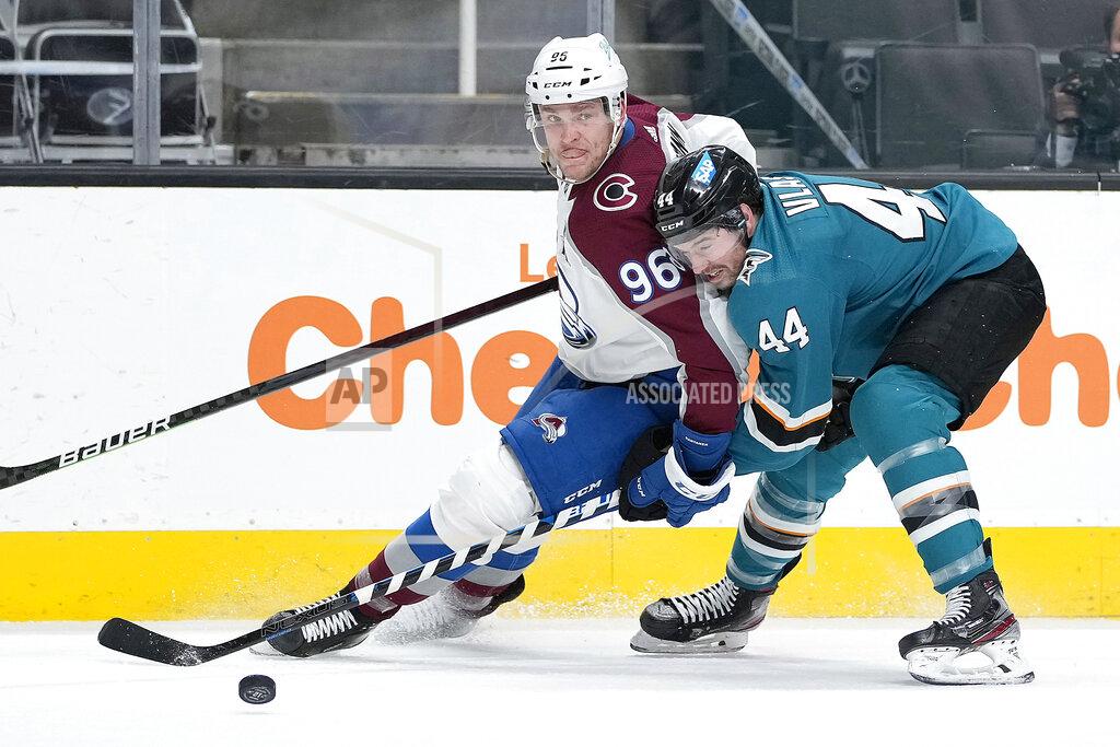 Tony Avelar Colorado Avalanche right wing Mikko Rantanen (96) battles for the puck against San Jose Sharks defenseman Marc-Edouard Vlasic (44) during the second period of an NHL hockey game in San Jose, Calif., on Wednesday, May 5, 2021. (AP Photo/Tony Avelar)