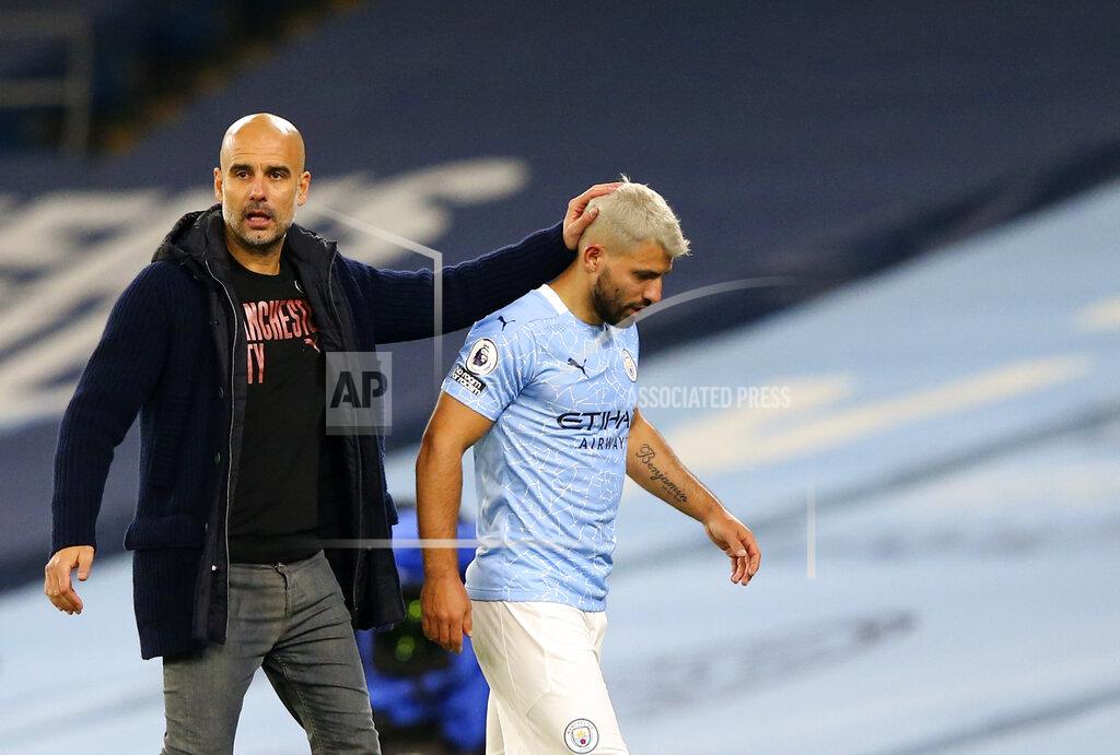 Alex Livesey Manchester City's Sergio Aguero passes by Manchester City's head coach Pep Guardiola after being substituted during the English Premier League soccer match between Manchester City and Arsenal at the Etihad stadium in Manchester, England, Saturday, Oct. 17, 2020. (Alex Livesey/Pool via AP)