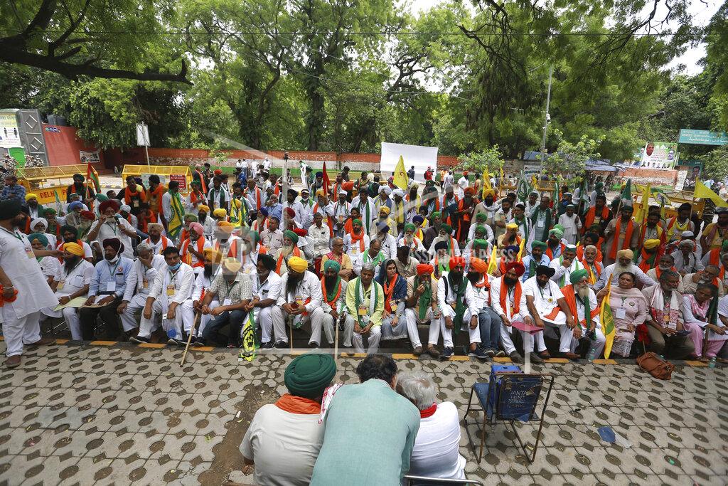 Uncredited Indian farmers hold a mock parliament as a mark of protest, in New Delhi, India, Thursday, July 22, 2021. More than 200 farmers on Thursday began a protest near India's Parliament to mark eight months of their agitation against new agricultural laws that they say will devastate their income. (AP Photo)