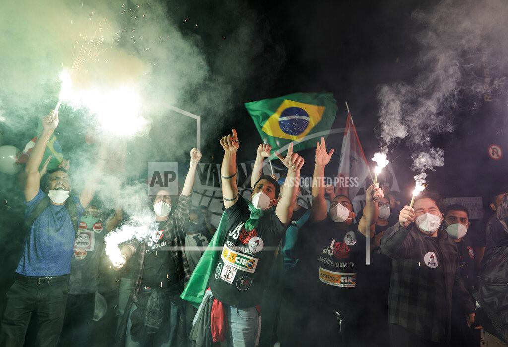 Marcelo Chello Demonstrators protest against Brazilian President Jair Bolsonaro's handling of the coronavirus pandemic and economic policies protesters say harm the interests of the poor and working class on Paulista Avenue, in Sao Paulo, Brazil, Saturday, June 19, 2021. Brazil's COVID-19 death toll is expected to surpass the milestone of 500,000 deaths on Saturday night. (AP Photo/Marcelo Chello)