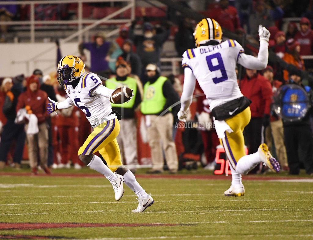 Michael Woods LSU defender Kary Vincent Jr. (5) celebrates after making an interception against Arkansas during the second half of an NCAA college football game, Saturday, Nov. 10, 2018, in Fayetteville, Ark. LSU won, 24-17. (AP Photo/Michael Woods)