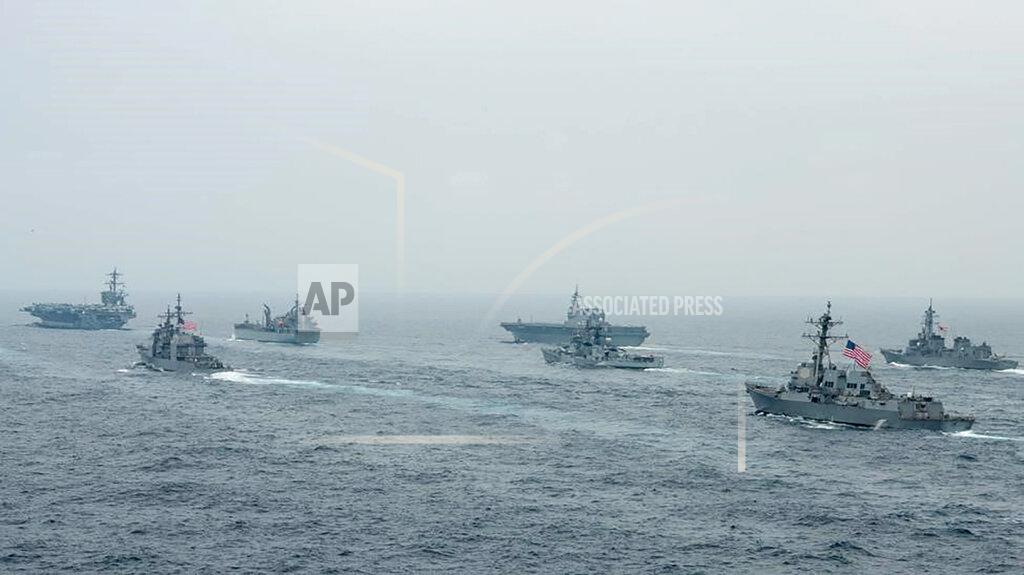 Mass Communication Specialist 2Nd Class Russel Lindsey In this photo released by U.S. Navy, US Navy aircraft carrier USS Carl Vinson (CVN 70) and other US and Allies vessels transit the Bay of Bengal as part of MALABAR 2021, on Oct. 12, 2021. China seeks to bring the strategically and symbolically important island back under its control, and the U.S. sees Taiwan in the context of broader challenges from China. (Russel Lindsey/US Navy via AP)