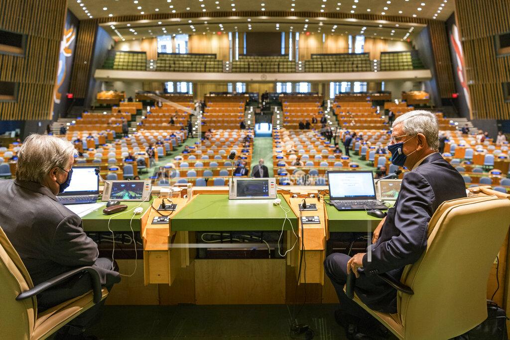 Rick Bajornas In this photo provided by the United Nations, Secretary-General António Guterres, left, speaks with Volkan Bozkir, president of the seventy-fifth session of the United Nations General Assembly, ahead of the General Assembly's seventy-fifth session, Tuesday, Sept. 22, 2020, at U.N. headquarters in New York. The U.N.'s first virtual meeting of world leaders started Tuesday with pre-recorded speeches from some of the planet's biggest powers, kept at home by the coronavirus pandemic that will likely be a dominant theme at their video gathering this year. (Rick Bajornas/UN via AP)