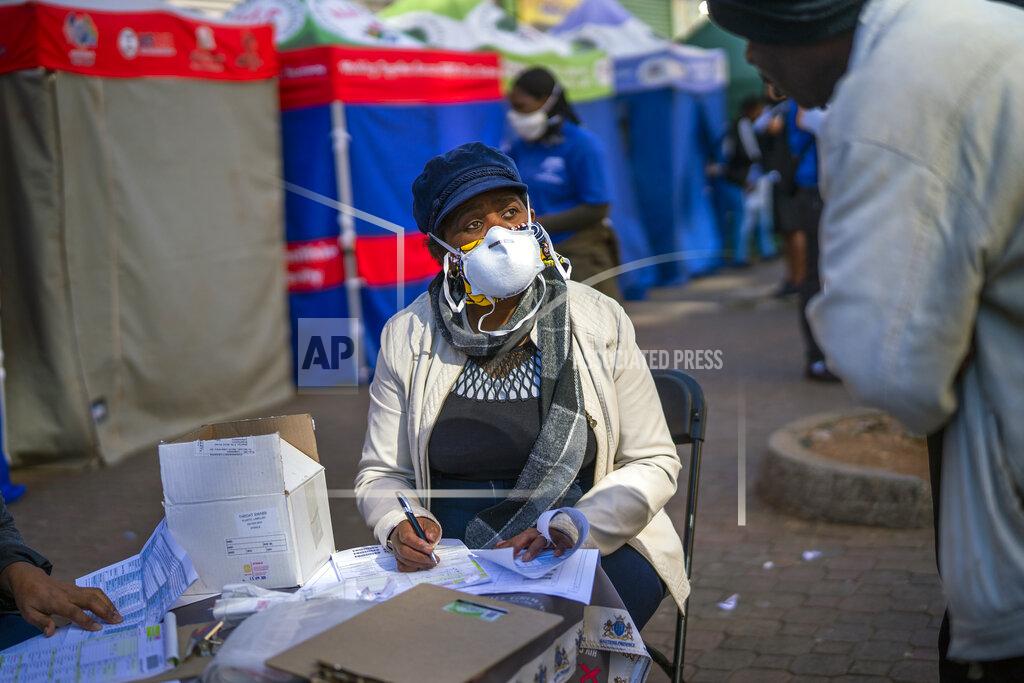 Jerome Delay A Johannesburg health official records residents who have been lining up to be tested for COVID-19 as well as HIV and Tuberculosis, in downtown Johannesburg Thursday, April 30, 2020. Thousands are being tested in an effort to derail the spread of coronavirus. South Africa will began a phased easing of its strict lockdown measures on May 1, although its confirmed cases of coronavirus continue to increase. (AP Photo/Jerome Delay)