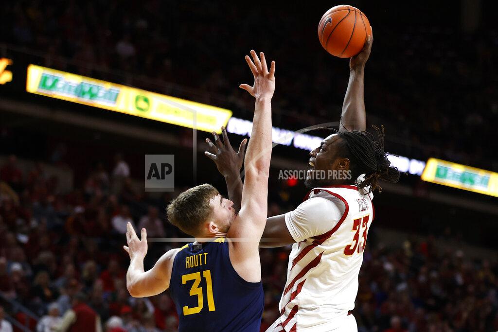 Matthew Putney Iowa State forward Solomon Young, right, shoots over West Virginia forward Logan Routt during the first half of an NCAA college basketball game Tuesday, March 3, 2020, in Ames, Iowa. (AP Photo/Matthew Putney)
