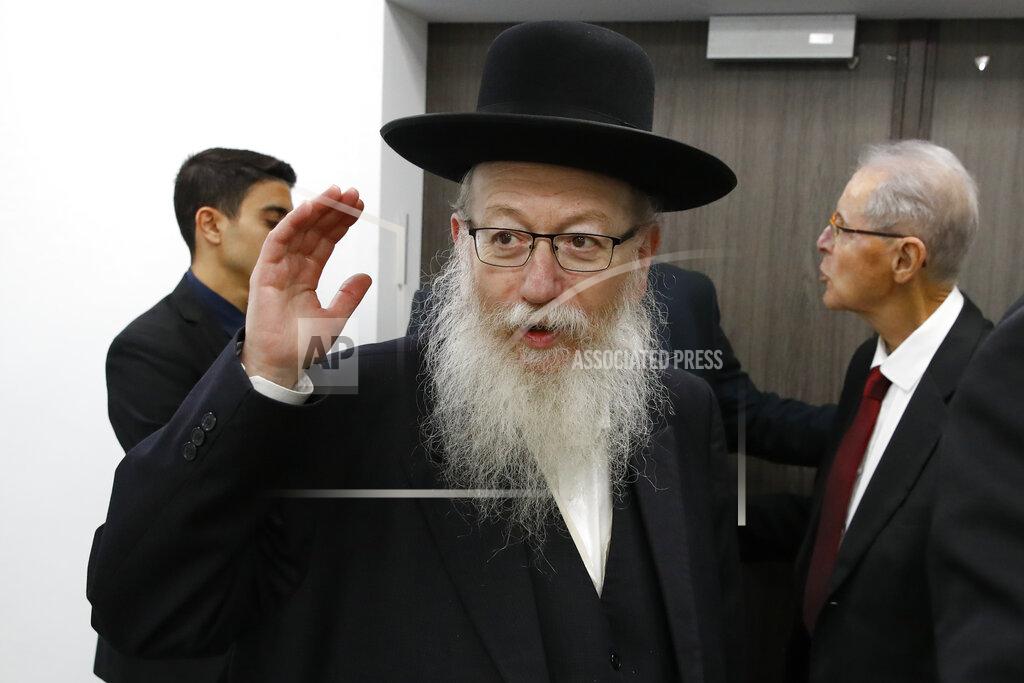 FILE - In this Feb. 23, 2020 file photo, Israeli Health Minister Yaakov Litzman arrives for a a situation assessment meeting with Prime Minister Benjamin Netanyahu and others regarding the Coronavirus, in Tel Aviv, Israel. Litzman said Sunday, April 26, 2020, that he is stepping down following a public uproar over his handling of the coronavirus crisis and his own COVID-19 infection. He said that he will take over as Construction Minister once a new government is formed. (Jack Guez/Pool via AP, File)