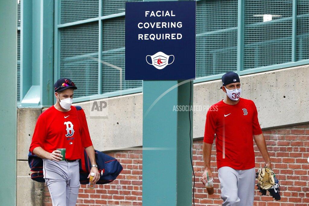 Michael Dwyer Boston Red Sox's Matt Barnes, right, walks to a bus with a teammate to be transported to an off-site facility for better social distancing between players out of concern for the coronavirus before baseball practice at Fenway Park, Sunday, July 5, 2020, in Boston. (AP Photo/Michael Dwyer)