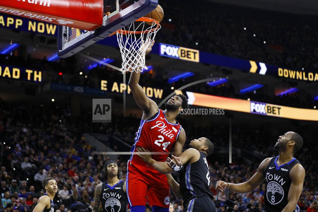 Philadelphia 76ers' Joel Embiid goes up for a shot against Golden State Warriors' Omari Spellman during the second half of an NBA basketball game Tuesday, Jan. 28, 2020, in Philadelphia. (AP Photo/Matt Slocum)