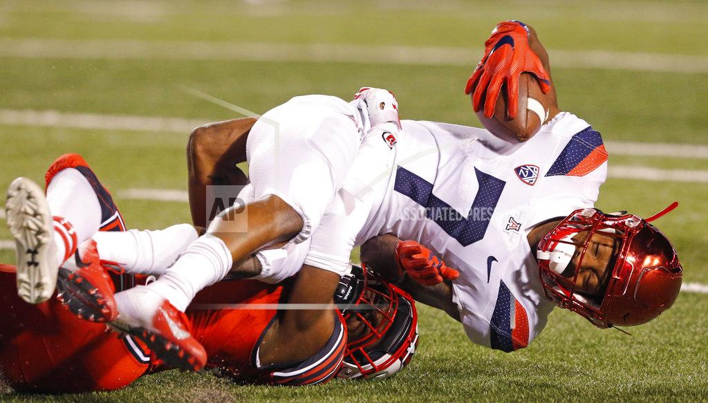 Rick Bowmer Utah defensive back Javelin K. Guidry, bottom, tackles Arizona wide receiver Devaughn Cooper (7) during the second half of an NCAA college football game Friday, Oct. 12, 2018, in Salt Lake City. (AP Photo/Rick Bowmer)
