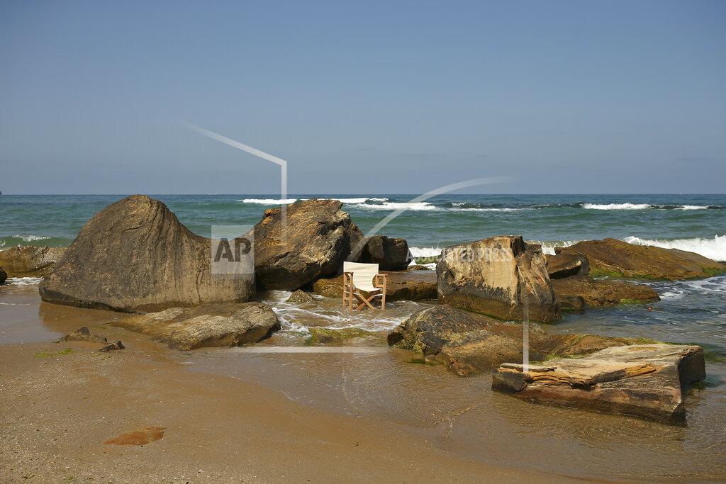 Emrah Gurel A chair on the beach in Kilyos, northern Istanbul, Thursday, April 29, 2021, a few hours before the start of the latest lockdown to help protect from the spread of the coronavirus. People stocked up on groceries, shoppers filled markets and many left cities for their hometowns or the southern coast as Turkey's strictest COVID-19 lockdown yet came into effect late Thursday. President Recep Tayyip Erdogan imposed a "full lockdown" until May 17 amid soaring COVID-19 infections and deaths. Turkey now ranks among the world's worst-hit countries and it's the first time that it is imposing a nearly three-week lockdown for the whole of the country. (AP Photo/Emrah Gurel)
