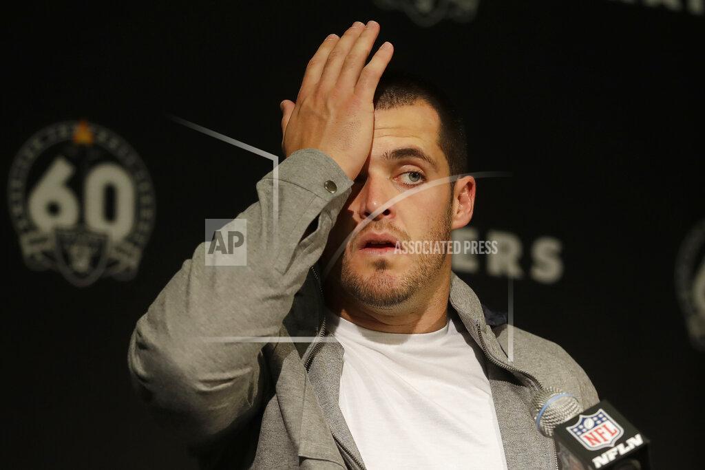 Ben Margot Oakland Raiders quarterback Derek Carr reacts at a news conference after an NFL football game against the Tennessee Titans in Oakland, Calif., Sunday, Dec. 8, 2019. (AP Photo/Ben Margot)