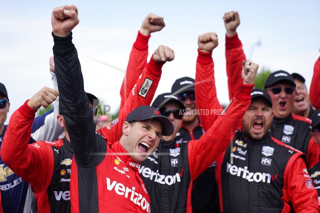 Paul Sancya Will Power, left, celebrates with his team after winning the IndyCar Detroit Grand Prix auto race on Belle Isle in Detroit, Sunday, June 5, 2022. (AP Photo/Paul Sancya)