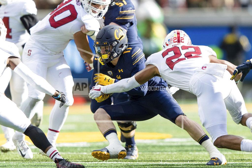 John Hefti California wide receiver Vic Wharton III, center, runs the ball as Stanford cornerback Obi Eboh (22) defends in the second quarter of a football game in Berkeley, Calif., Saturday, Dec. 1, 2018. (AP Photo/John Hefti)