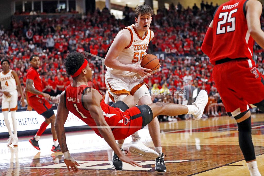 Brad Tollefson Texas' Will Baker (50) charges through Texas Tech's Terrence Shannon Jr. (1) during the first half of an NCAA college basketball game Saturday, Feb. 29, 2020, in Lubbock, Texas. (AP Photo/Brad Tollefson)