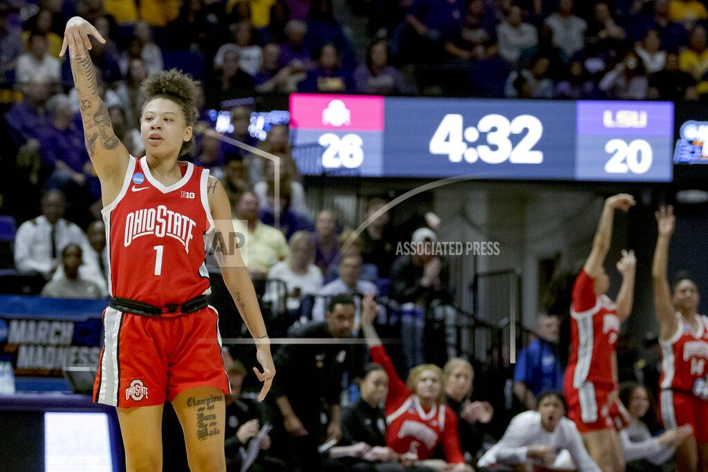 Matthew Hinton Ohio State guard Rikki Harris (1) and the team bench react after Harris made a 3-point basket during the first half of a women's college basketball game against LSU in the second round of the NCAA tournament, Monday, March 21, 2022, in Baton Rouge, La. (AP Photo/Matthew Hinton)