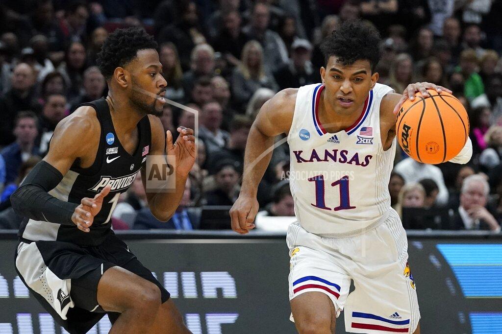 Nam Y. Huh Kansas' Remy Martin drives past Providence's Al Durham during the second half of a college basketball game in the Sweet 16 round of the NCAA tournament Friday, March 25, 2022, in Chicago. (AP Photo/Nam Y. Huh)