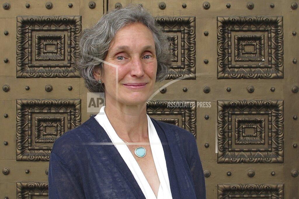 Lisa Rathke Rebecca Holcombe, who is running for governor as a Democrat, poses in front of the Vermont Statehouse on Tuesday, Aug. 4, 2020, in Montpelier, Vt. (AP Photo/Lisa Rathke)