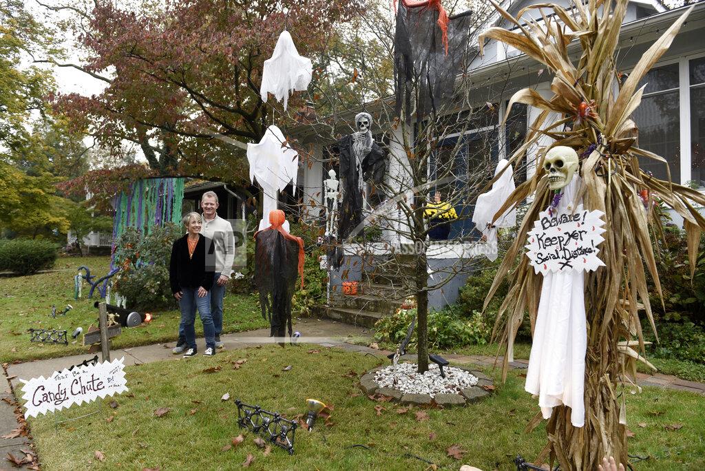 Michael Perez Carol McCarthy and her husband, Tom, pose for a portrait at their home they decorated for Halloween, Monday, Oct. 26, 2020, in Palmyra, N.J. (AP Photo/Michael Perez)