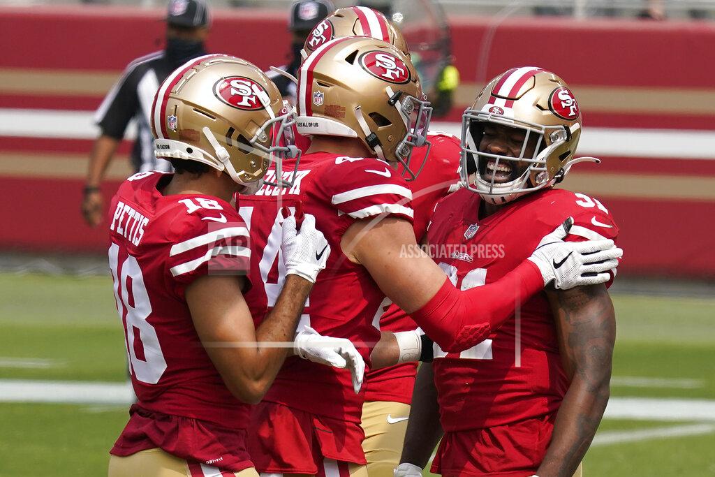 Tony Avelar San Francisco 49ers running back Raheem Mostert, right, celebrates with teammates after scoring against the Arizona Cardinals during the first half of an NFL football game in Santa Clara, Calif., Sunday, Sept. 13, 2020. (AP Photo/Tony Avelar)