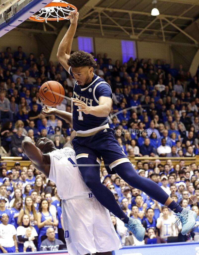 Gerry Broome Georgia Tech's James Banks III (1) dunks over Duke's Zion Williamson (1) during the first half of an NCAA college basketball game in Durham, N.C., Saturday, Jan. 26, 2019. (AP Photo/Gerry Broome)