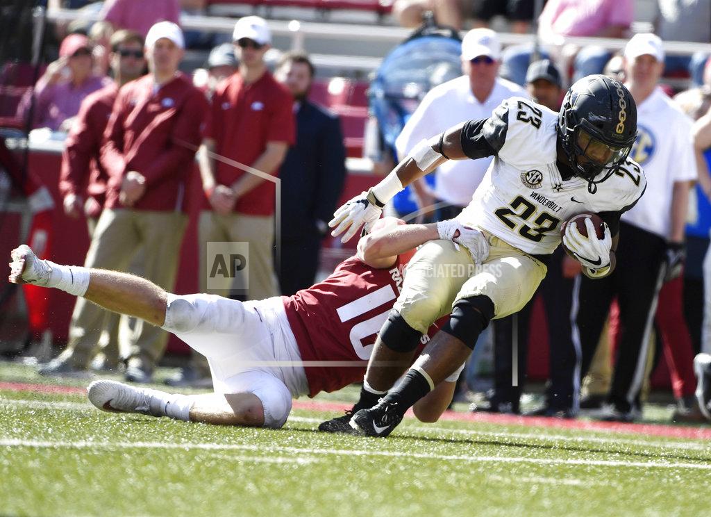 Michael Woods Arkansas defender Bumper Pool tackles Vanderbilt running back Khari Blasingame just short of the goal line in the first half of an NCAA college football game Saturday, Oct. 27, 2018, in Fayetteville, Ark. (AP Photo/Michael Woods)