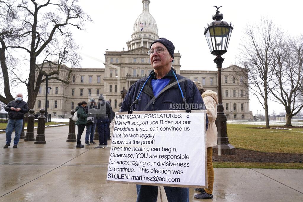 Paul Sancya Martin Szelag stands outside the state capitol in Lansing, Mich., Sunday, Jan. 17, 2021. (AP Photo/Paul Sancya)