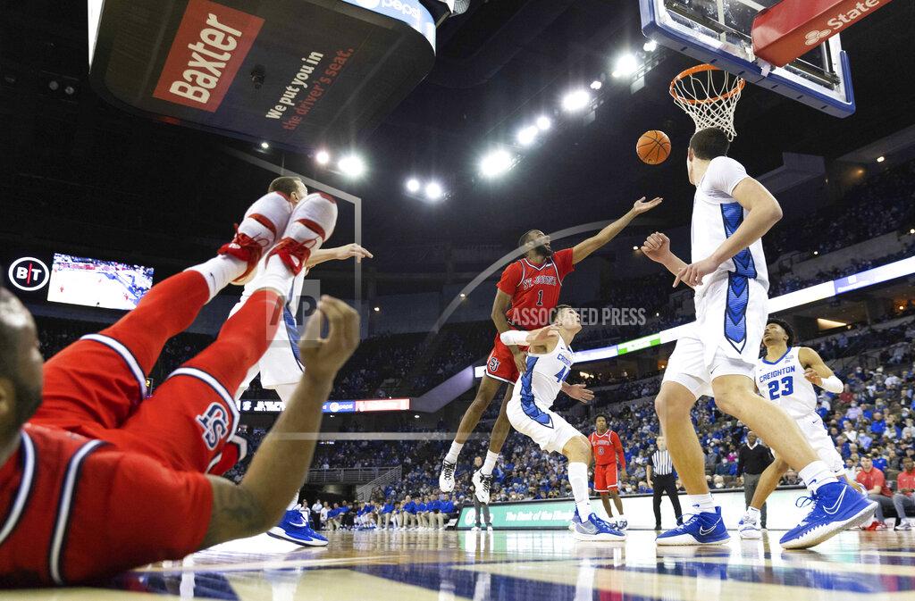 Rebecca S. Gratz St. John's Aaron Wheeler (1) shoots against Creighton's Ryan Hawkins (44) during the second half of an NCAA college basketball game Wednesday, Jan. 19, 2022, in Omaha, Neb. Creighton defeated St. John's 87-64. (AP Photo/Rebecca S. Gratz)