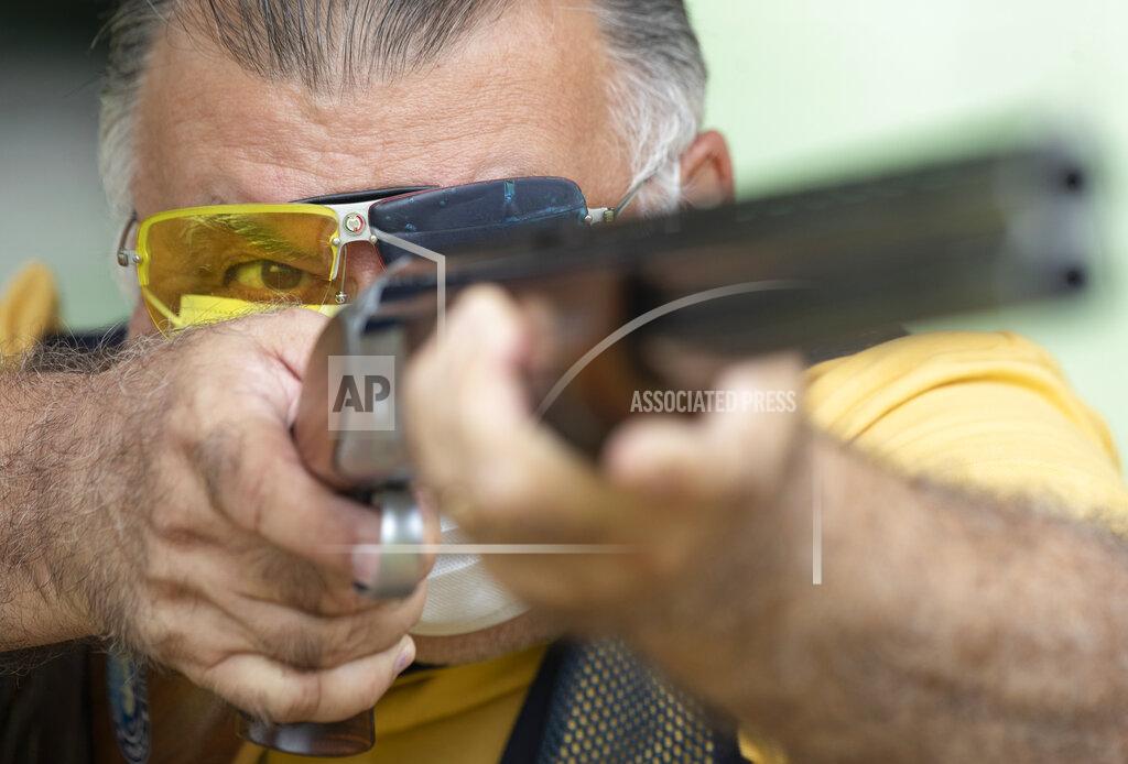 Andre Penner FILE - In this Feb. 24, 2021 file photo, Owner Eduardo Barzana practices at a shooting range in Americana, Brazil. “Guns are like cellphones; it’s the person behind them who matters,” said Barzana. “What the government is doing is benefiting our sport and giving average citizens the right to defend themselves.” (AP Photo/Andre Penner, File)
